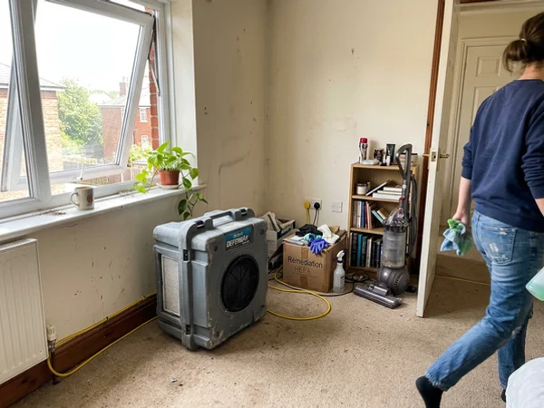 HEPA air scrubber managing indoor air quality after treatment