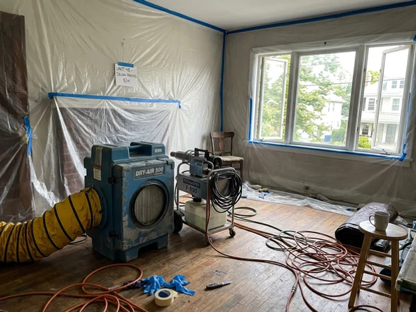 Air scrubbers and odor equipment staged in an emptied room
