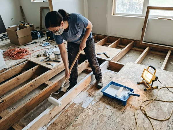 Subfloor and joists receiving antimicrobial encapsulation